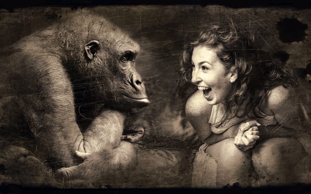 Girl showing excitement at seeing ape